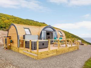 a luxurious tiny house on a hill with a deck at 2 Bed in Tain oc-81340 in Nigg