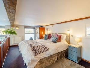 a large bedroom with a large bed and a window at 1 Bed in Carnforth oc-90528 in Beetham