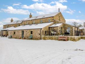 a large brick building with snow on the ground at 5 Bed in Lancaster oc-90546 in Burton in Lonsdale