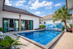 a swimming pool in the backyard of a villa at Cocoloco Pool Villa Ao Nang in Ao Nang 