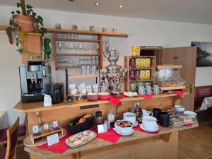 a kitchen with a counter with food on it at Pension Speckmoser in Bad Mitterndorf
