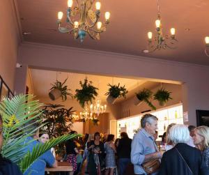 a group of people standing in a restaurant at The Willets Boutique Hotel in Simonʼs Town