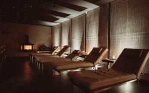 a row of chairs lined up in a row at Hotel Horal in Rožnov pod Radhoštěm +53 photos