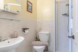 a bathroom with a toilet and a sink and a shower at 2 Bed in Bakewell oc-t34225 in Bakewell