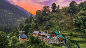 a house on the side of a mountain at Private Mudhouse Duplex Cottage by Kahani in Jibhi +33 photos