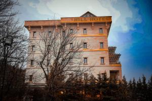 a building with a sign on the top of it at Kapadokya Hill Hotel & Spa in Nevşehir