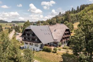 an aerial view of a large house with a roof at stuub jostal in Titisee-Neustadt