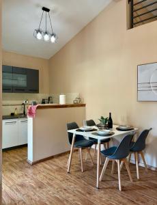 a kitchen and dining room with a table and chairs at Villa Piste - Skadar Lake in Virpazar