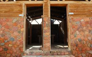 an opening in a brick building with two windows at Dagal Camp - دجل كامب in Sharm El Sheikh