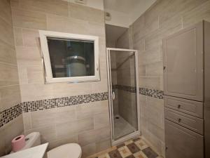 a bathroom with a shower and a toilet and a sink at Hostel-Élisée-Perpignan in Perpignan +58 photos