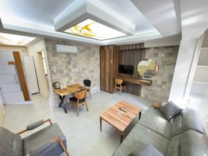 a living room with a couch and a table at Konak Asil in Uşak