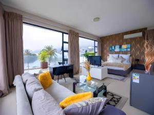 a living room with a couch and a table at Grande Hotel in Cape Town