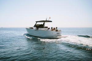 a group of people on a boat in the water at Mas de Torrent Hotel & Spa, Relais & Châteaux in Torrent