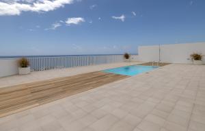 a swimming pool on the roof of a building at MSV Beach in Puerto Naos