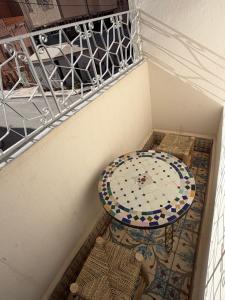 a room with a table and a mosaic floor at Studio in City Center Living at Heart of It All, 200 m away from CTM in Er Rachidia