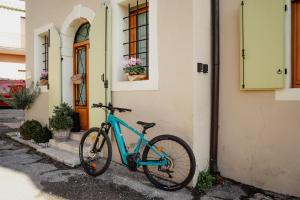 a blue bike parked outside of a house at ILLASI DREAM ROOMS in Illasi