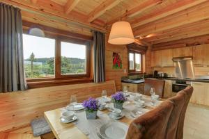 a dining room with a table in a cabin at Ecolodge Sauerland 2 in Medebach