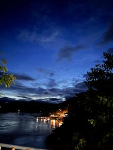 a view of a lake at night at Janh Ya Phone Guesthouse in Pakbeng +14 photos