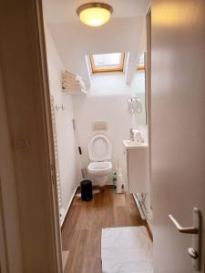 a small bathroom with a toilet and a window at Top Studio Vincennes Centre - SV75 in Vincennes +25 photos