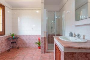 a bathroom with a sink and a shower at B&B Gassa d'Amante in Capoterra +39 photos