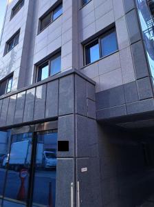 a tall building with a parking meter in front of it at Fresh Stay in Seoul