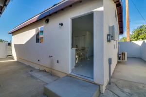 a building with a large sliding glass door on it at 13 Mi to Universal Studios: Renovated Cottage! in Los Angeles