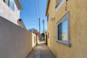 an alley between two buildings with a window at 13 Mi to Universal Studios: Renovated Cottage! in Los Angeles +17 photos