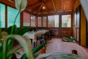a dining room with tables and chairs in a restaurant at B&B Gassa d'Amante in Capoterra