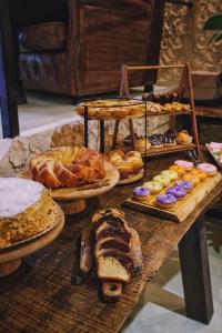 a table with many different types of bread and pastries at 262 Boutique Hotel in Lisbon