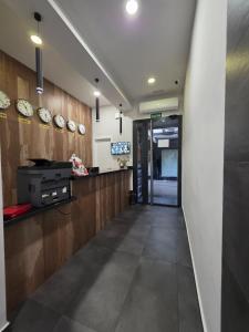 an office with a hallway with clocks on the wall at HOSTAL GOLDEN 21*** in Madrid +33 photos