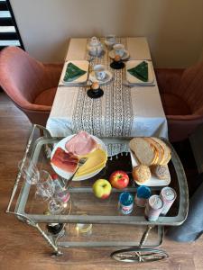 a table with a tray of food on it at Snow&Rose in Damme