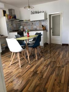 a kitchen and dining room with a table and chairs at Kasakarma in Agira +25 photos
