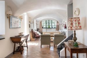 a living room with a table and a couch at Eremo della Maddalena the oasis of the 5Terre in Monterosso al Mare