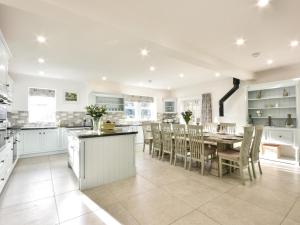 a kitchen and dining room with a table and chairs at 6 Bed in Otley oc-g0022 in Fewston