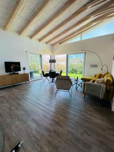 a large living room with a couch and a table at Sanddornhus in Ahrenshoop