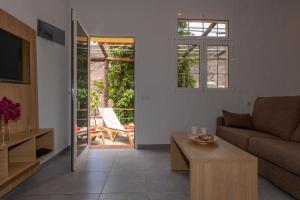 a living room with a couch and a table at GC0284 El Granero in Mogán