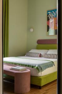 two beds sitting next to each other in a room at Hotel Marisa in Rome