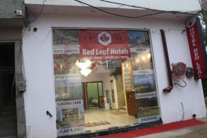 a store front of a red leaf hotels building at Red Leaf Hotel in Māler Kotla +16 photos