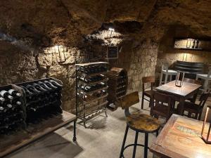 a wine cellar with a bunch of wine bottles at Tuscany Charme Apartments in Asciano