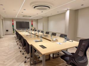 a large conference room with a long table and chairs at Coral Beach Hotel & Spa in Aqaba +26 photos