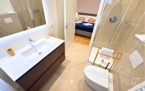 a bathroom with a sink and a shower and a toilet at HT - Basilica View Luxury Loft in Padova +11 photos