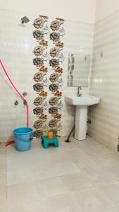 a bathroom with a sink and a shower at Hotel Orchha Inn in Orchha