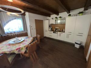 a kitchen and dining room with a table and chairs at Opilý Sklep č3 in Velké Pavlovice +19 photos