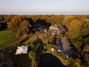 an aerial view of a house with a marina at Landhuis Hotel Restaurant Rikus in Eext