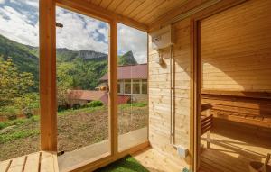 a view from the outside of a wooden house with a large window at Retraites & Séminaires, Spa, La Ressource Malix 19 personnes in Tenay +27 photos