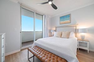 a bedroom with a large bed and a large window at Beach Club D-801 in Gulf Highlands