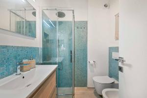 a bathroom with a glass shower and a toilet at Casa Elisabeth in Portovenere
