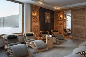 a salon with chairs and a waiting room at Hotel La Bussola in Andalo