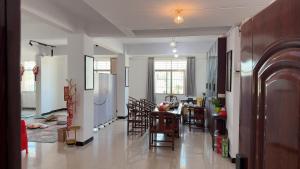 a kitchen and dining room with a table and chairs at 道和轩民宿 in Heyuan