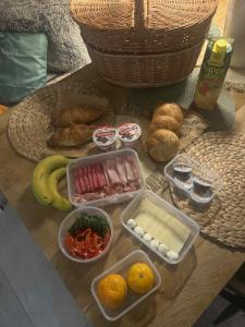 a table topped with bowls of food on a table at Treetop Tiny House Pod Korunami in Horná Mičiná